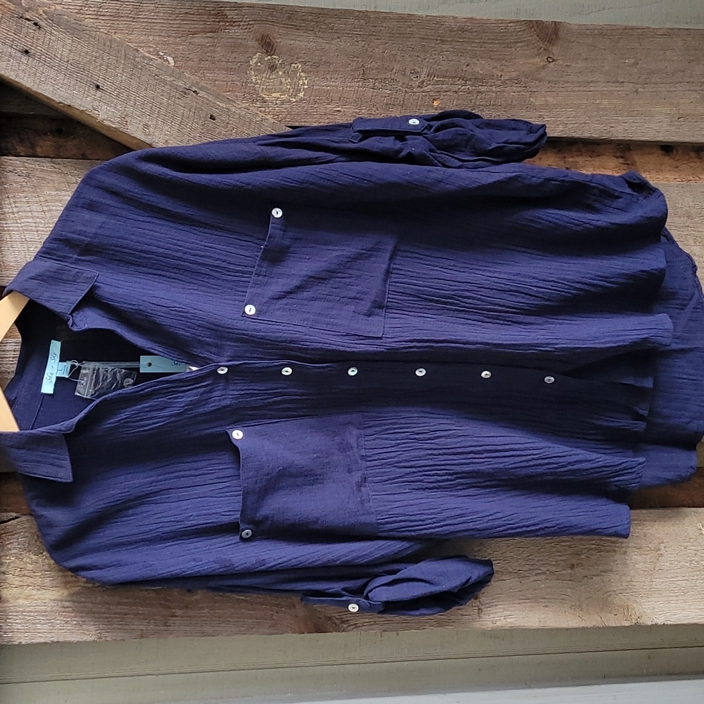 Brand new ladies button down with  button sleeve option. Navy size Large